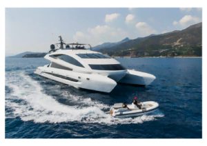 Royal-Falcon-One-Luxury-Power-Catamaran-Charter The ultra-modern royal falcon one luxury power catamaran cruising in bodrum, showcasing its expansive dual-hull design and wide beam.