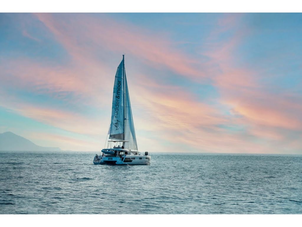 A luxury catamaran charter turkey sailing smoothly through the turquoise waters of gocek.