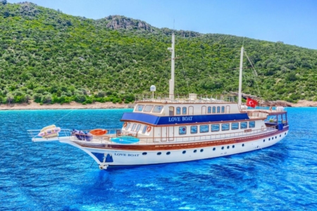 Aerial view of Love Boat Gulet with 36 guests dining on the aft deck in Bodrum, Turkey.