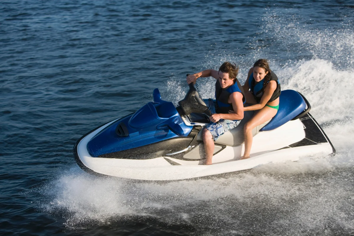 Exclusive Luxury Yacht Charter Water Sport Jet Ski | Yachttogo Guests riding a jet ski, experiencing premium water sports activities included in an exclusive luxury yacht charter.
