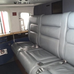 Sikorsky S-76C++ executive twin-engine helicopter waiting on the tarmac at Istanbul Airport for a VIP superyacht transfer.