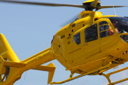 The airbus h145 twin-engine vip helicopter prepared for a maritime charter operation on the tarmac.