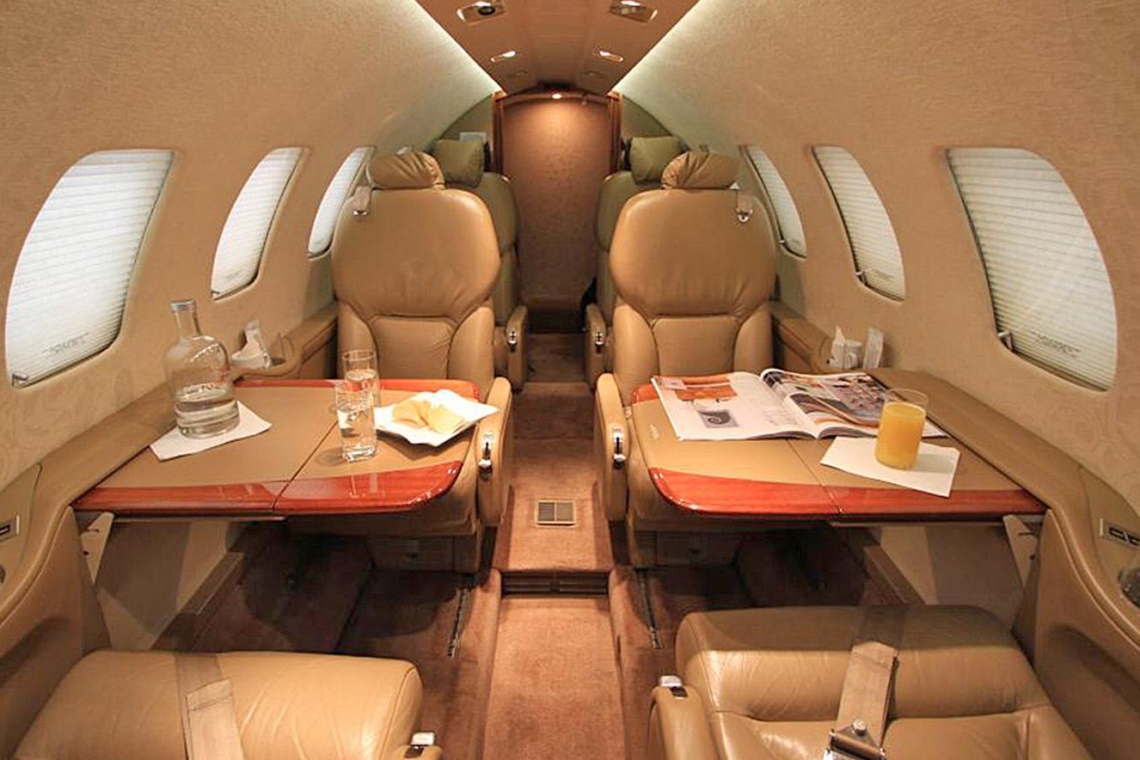 Exterior view of the Cessna Citation Bravo light private jet waiting on the tarmac for a VIP charter flight.