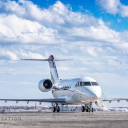 Exterior view of the Bombardier Challenger 650 heavy private jet prepared for a transcontinental VIP charter.