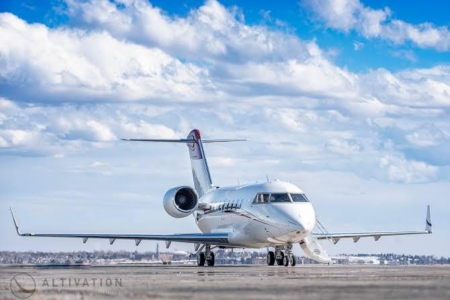 Exterior view of the bombardier challenger 650 heavy private jet prepared for a transcontinental vip charter.