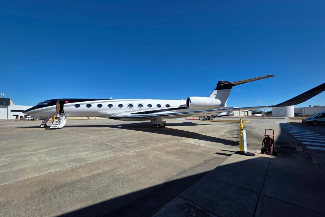 Exterior profile of the Gulfstream G700 ultra-long-range private jet dominating the tarmac.