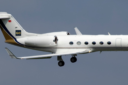 Exterior profile of the gulfstream iv-sp heavy private jet waiting on the tarmac for a vip charter flight.
